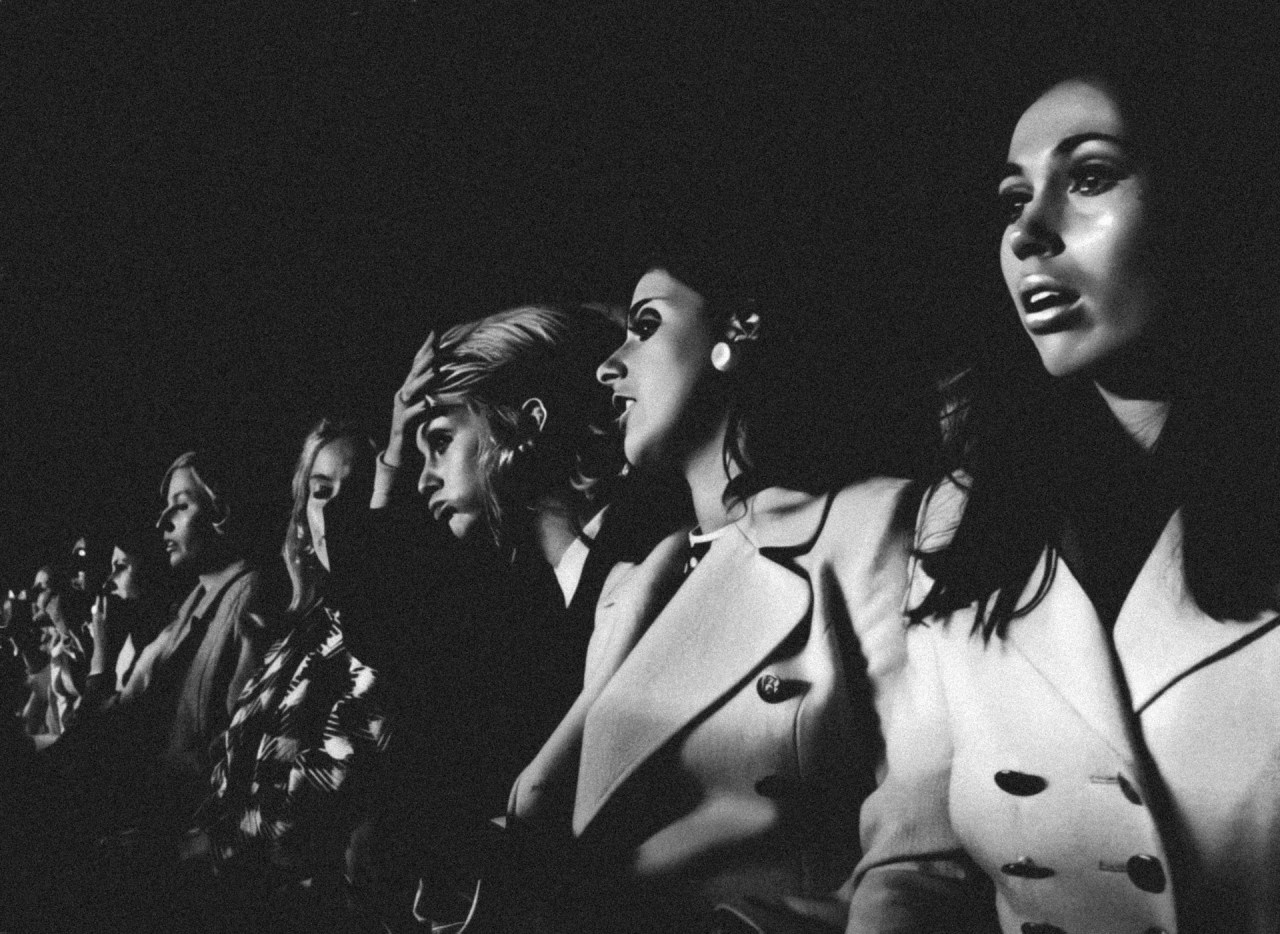 Group of women seated together in conversation, representing how repeated behavior can reveal important patterns in relationships.