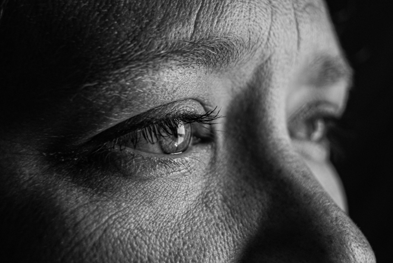 Woman looking tearful and reflective, representing the realization that you did not deserve the pain you experienced.